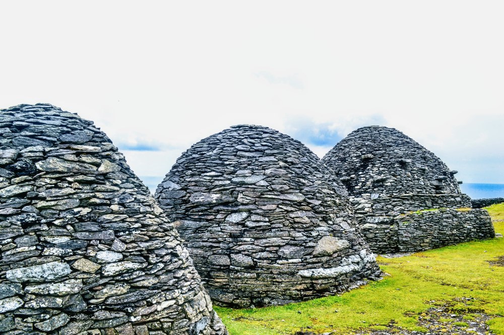 3 dome-shaped stone structures.