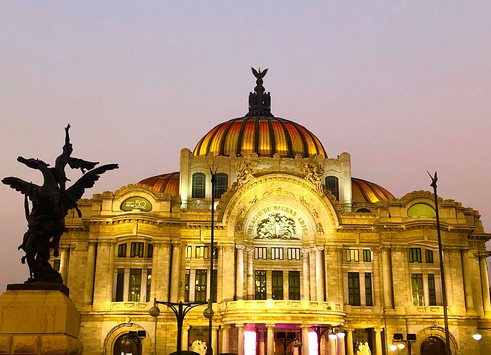 Ornate domed building, lit up by spotlights.