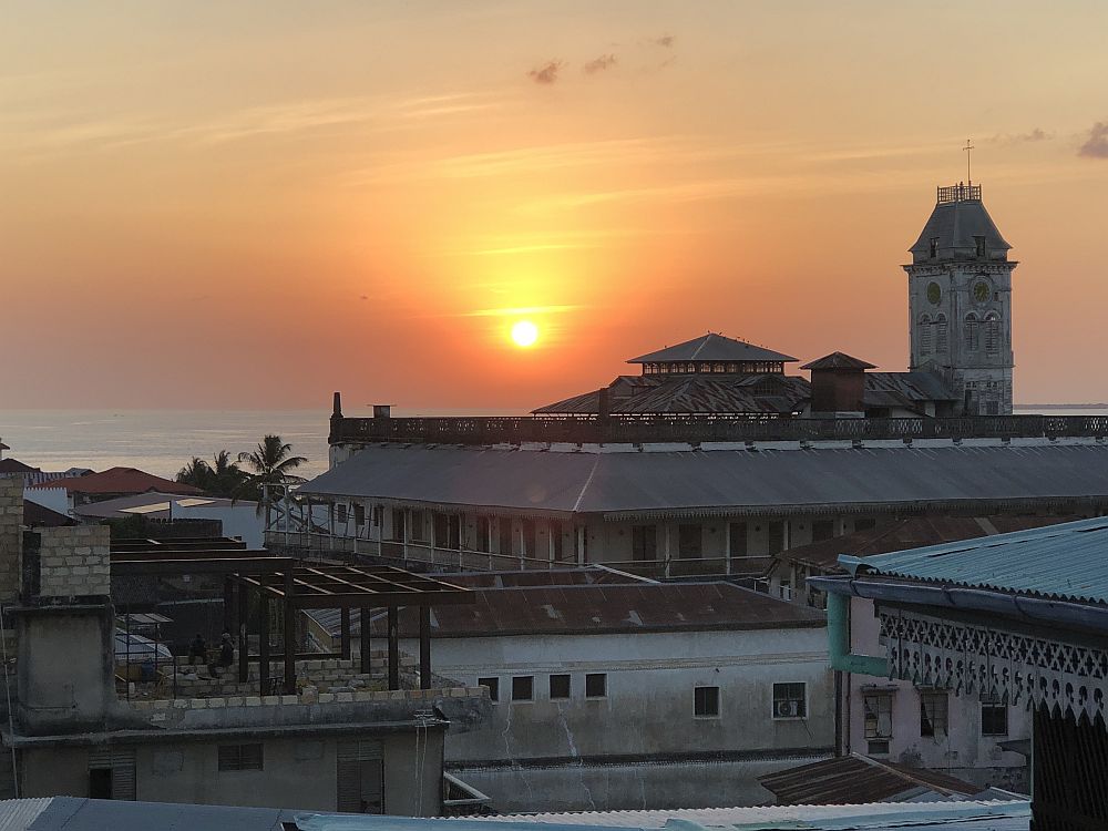 Sunset over buildings (and one taller tower).