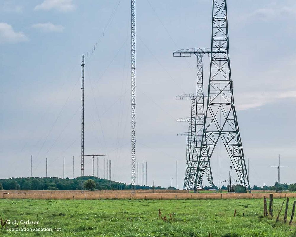 At Grimeton Radio Station: A flat green field, with several very tall metal radio towers scattered across it.