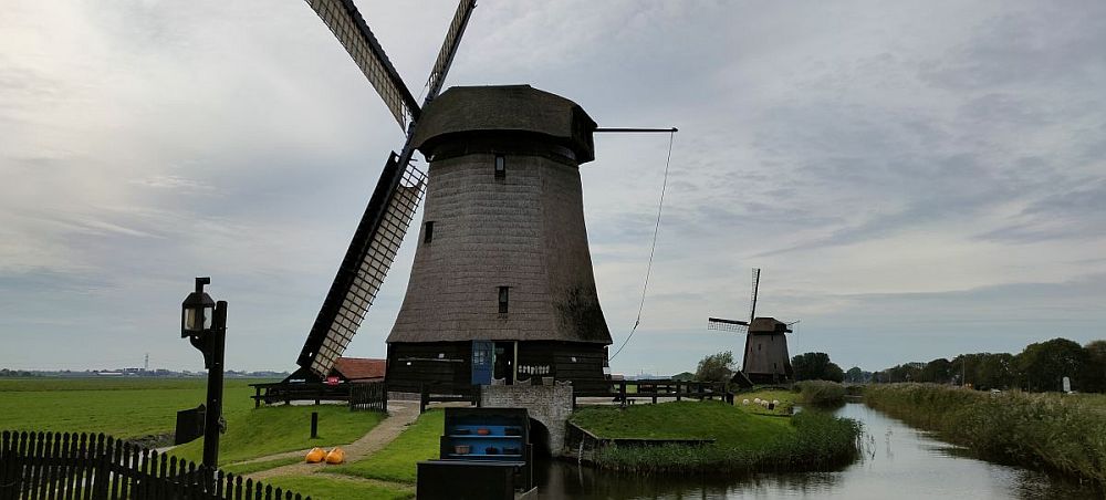 Two windmills along a small canal in the Beemster Polder.