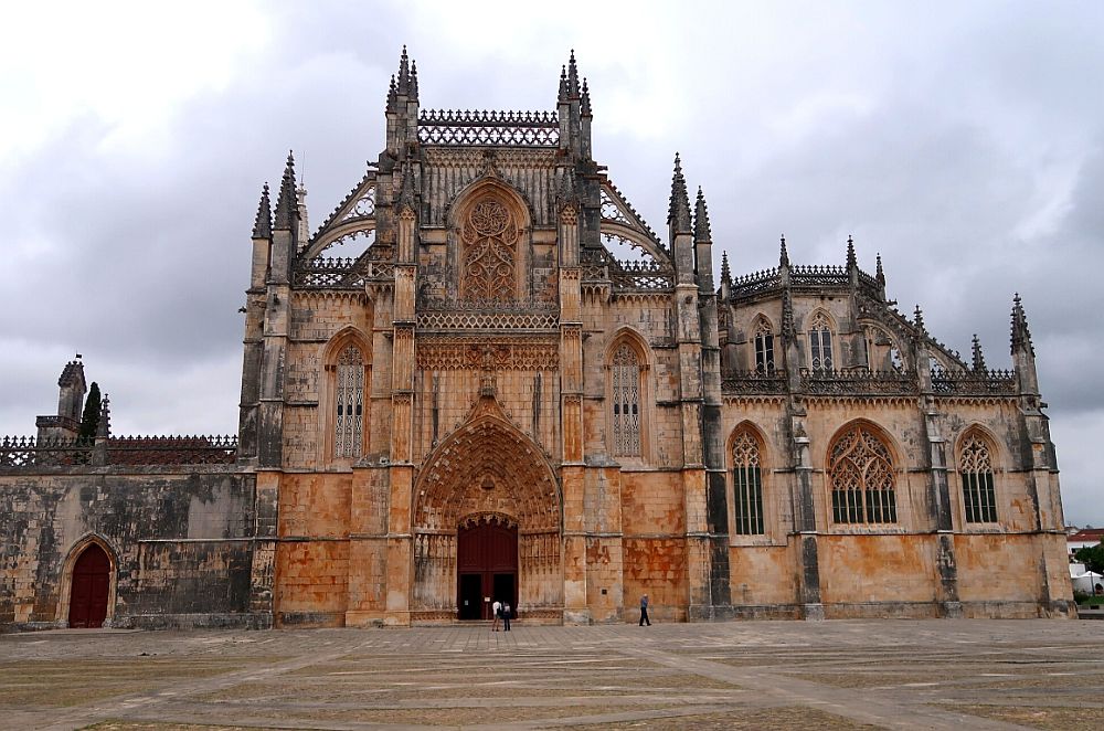 The church is primarily rectangular shapes, with no high church tower, but all of the edges - the roof lines and the windows - are embellished with detailed gothic-style stone lacework. 