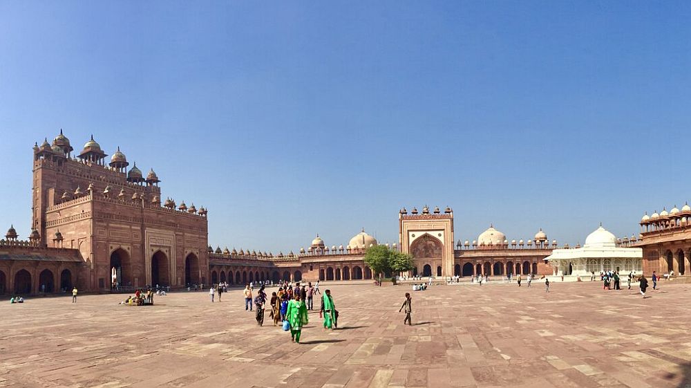 A large plaza with the buildings of Fatehpur Sikri around its sides.