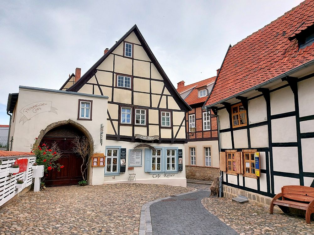 A cobblestone street with half-timbered houses in Quedlinburg, Germany