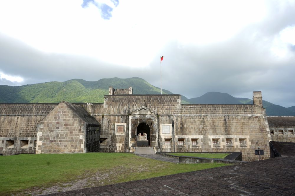 A gateway into Brimstone Hill Fortress, an archway topped by a flag.