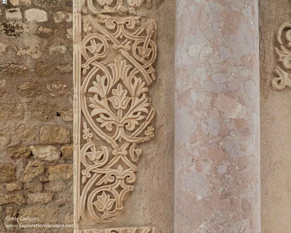 Detail from the ruins of Medina Azahara: detailed decorative stonework in a leafy pattern.
