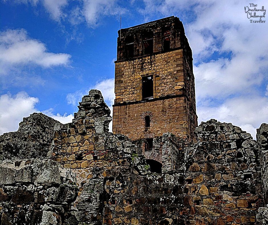 Panama Viejo fortification ruins: stone walls and a tall square tower.