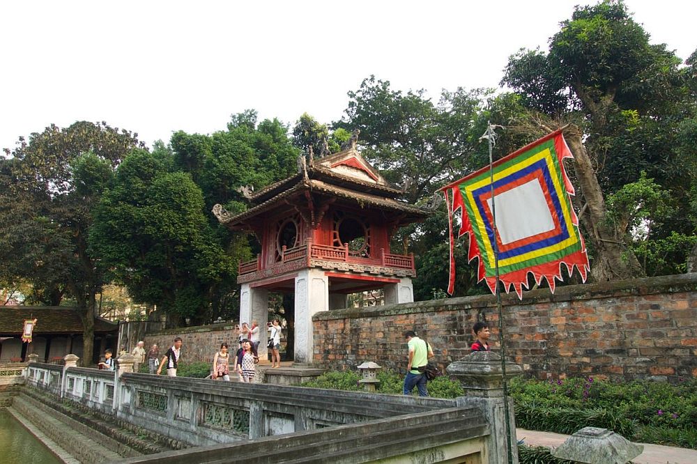 A small temple, painted red with traditional curved roof corners.