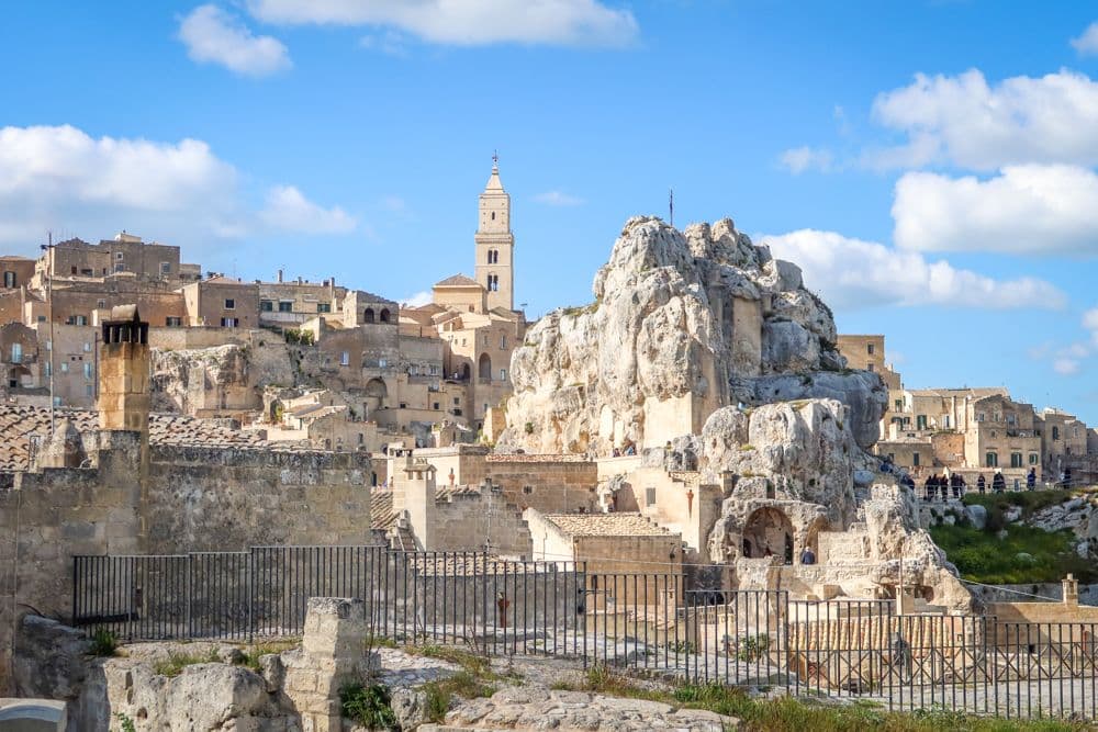 View of Matera show a stone hill with cave entrances.