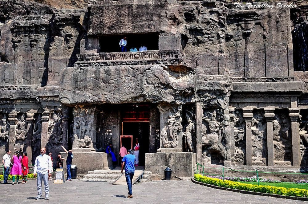The entrance to one of the Ellora Caves, with an intricately carved front.