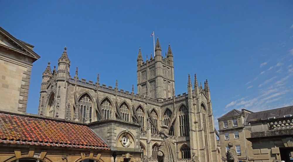 A closer look at Bath Abbey, with its gothic arches and buttresses.