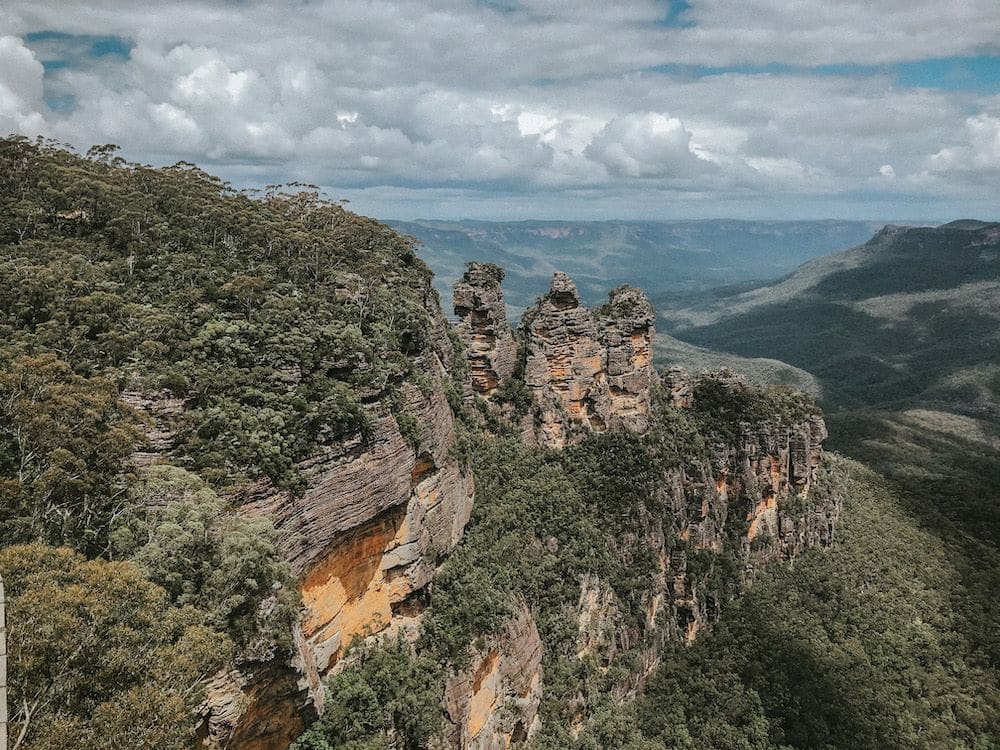 View over mountains, with rock formations on the nearest one.