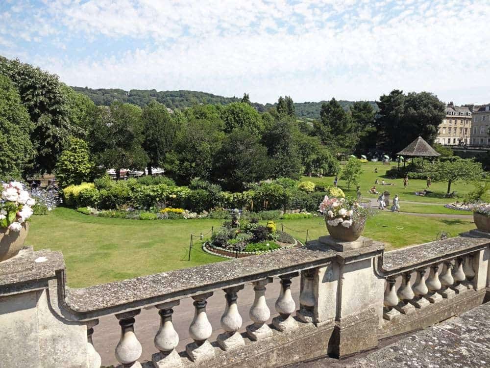 A view over a part of the Parade Gardens in Bath: neat flowerbeds and tidy mown grass between them.