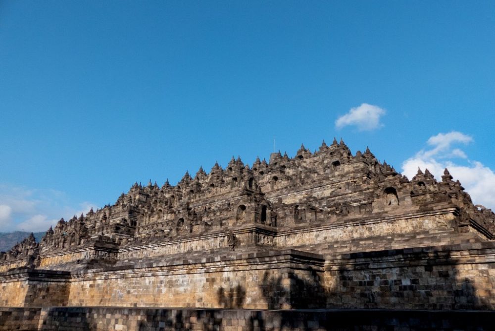 A view looking up at the pyramid-like temple platform at Borobudur