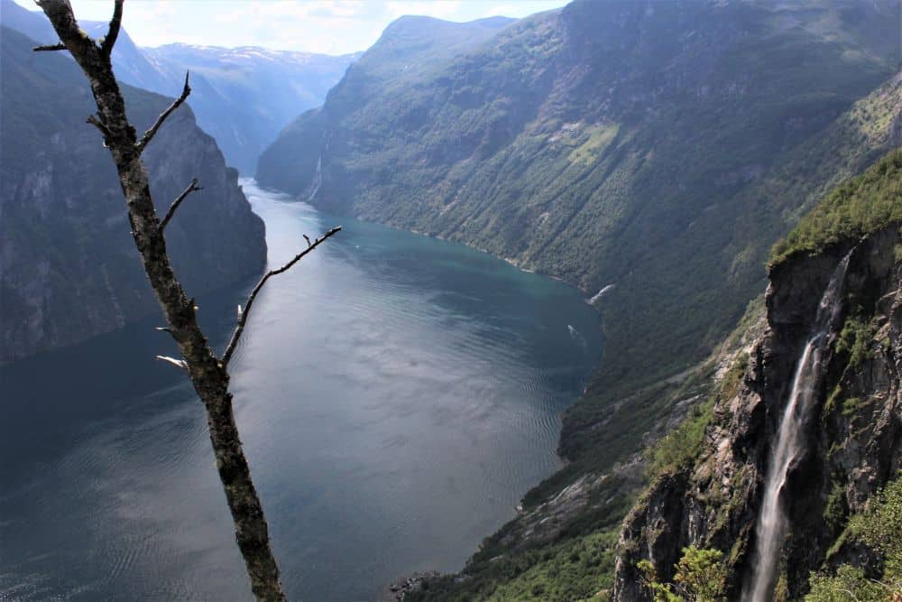 Looking down on a long narrow body of water, with steep mountain walls on both sides.