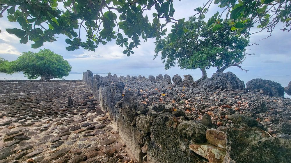 A marea paved with stones and some upright stones around its edges.