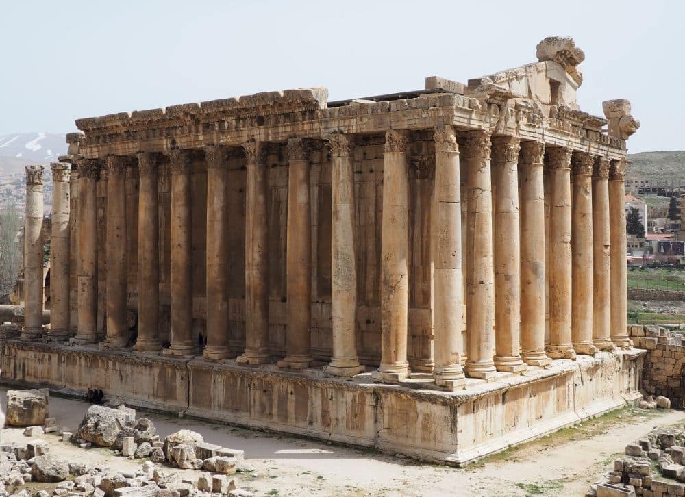 An entire temple, on a high base, surrounded by Corinthian columns.