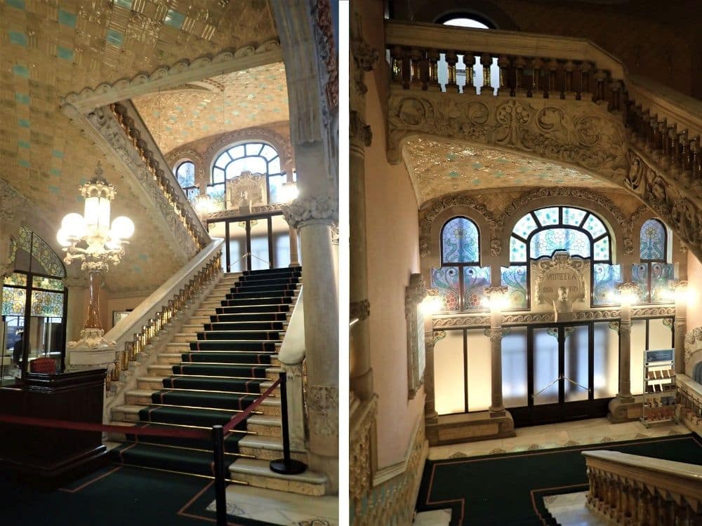 2 photos in one: on the left, ooking up a long stairway with ornate ornamentation and a huge art-nouveau lamp on the bottom of its bannister. On the right a landing, where the ornate plasterwork along the bottom of the stairs is visible.