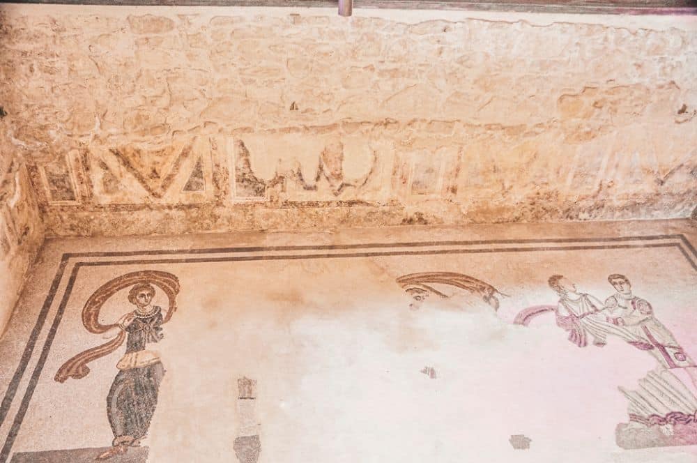 On the floor the mosaics are rather damaged, but the parts that remain are very clear and somewhat bright and show human figures.