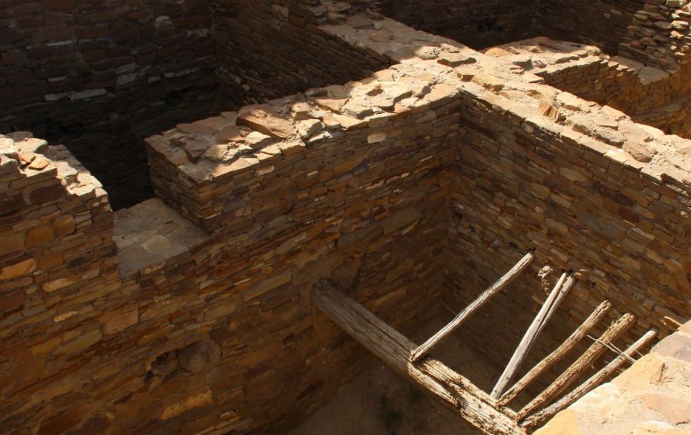 Looking down on walls, with parts of a wooden ceiling still in place.