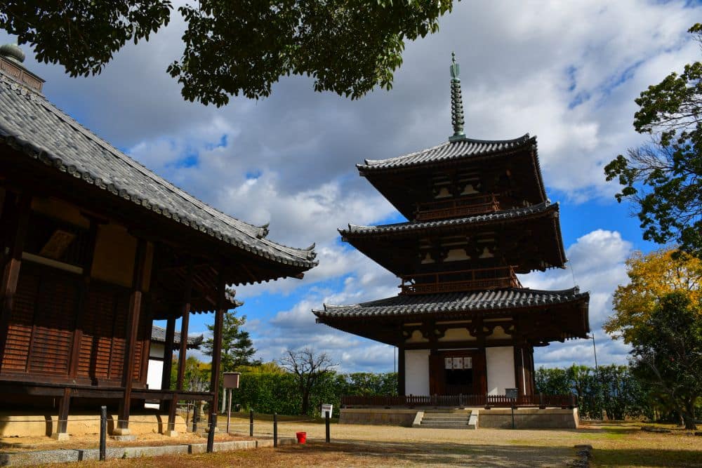 A pagoda with three roof levels.