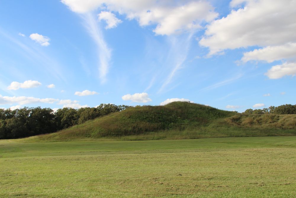 View of several grass-covered mounds at Poverty Point.