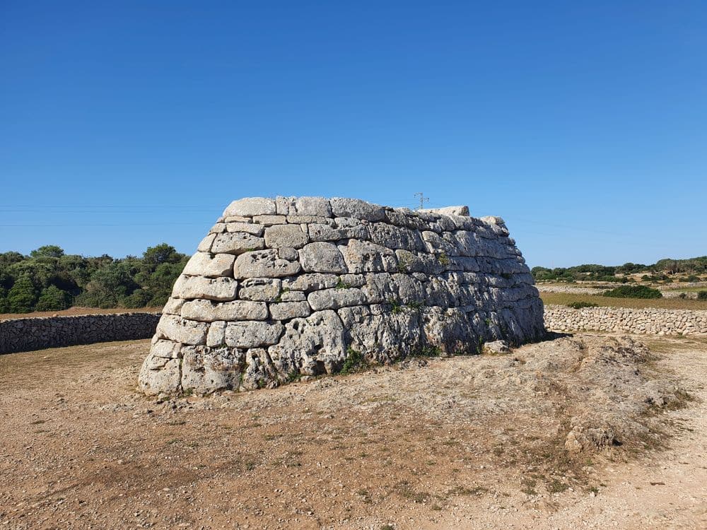 An oval stone-walled structure with a flat top.