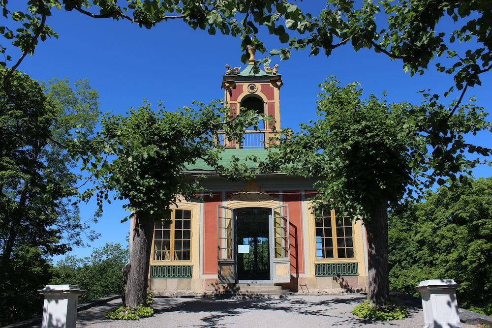 A small outbuilding - one story with a cupola on top.