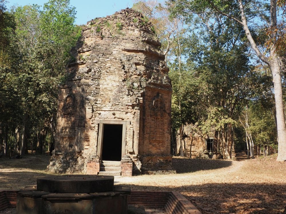 A small temple at Sambor Prei Kuk that is octagonal, with a door in the front and a rounded top. 