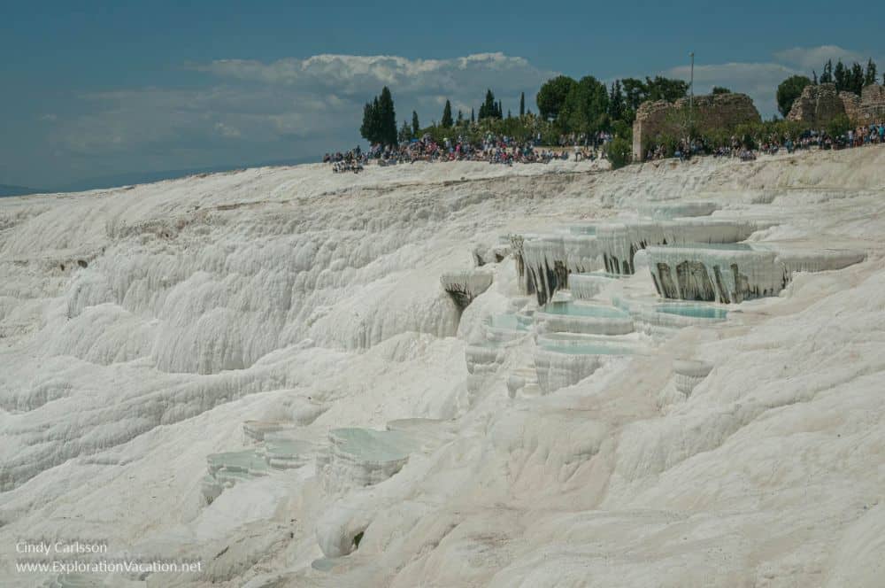 a view of the white terraces from a distance, looking much like snow.