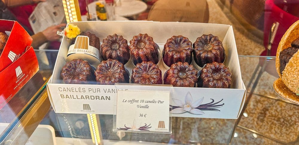 A box displayed in a shop window: 10 caneles in the box.