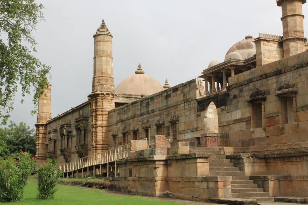 An imposing stone building with a tall minaret.