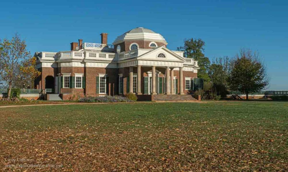 Brick building with neoclassical portico on the front and a dome on top.