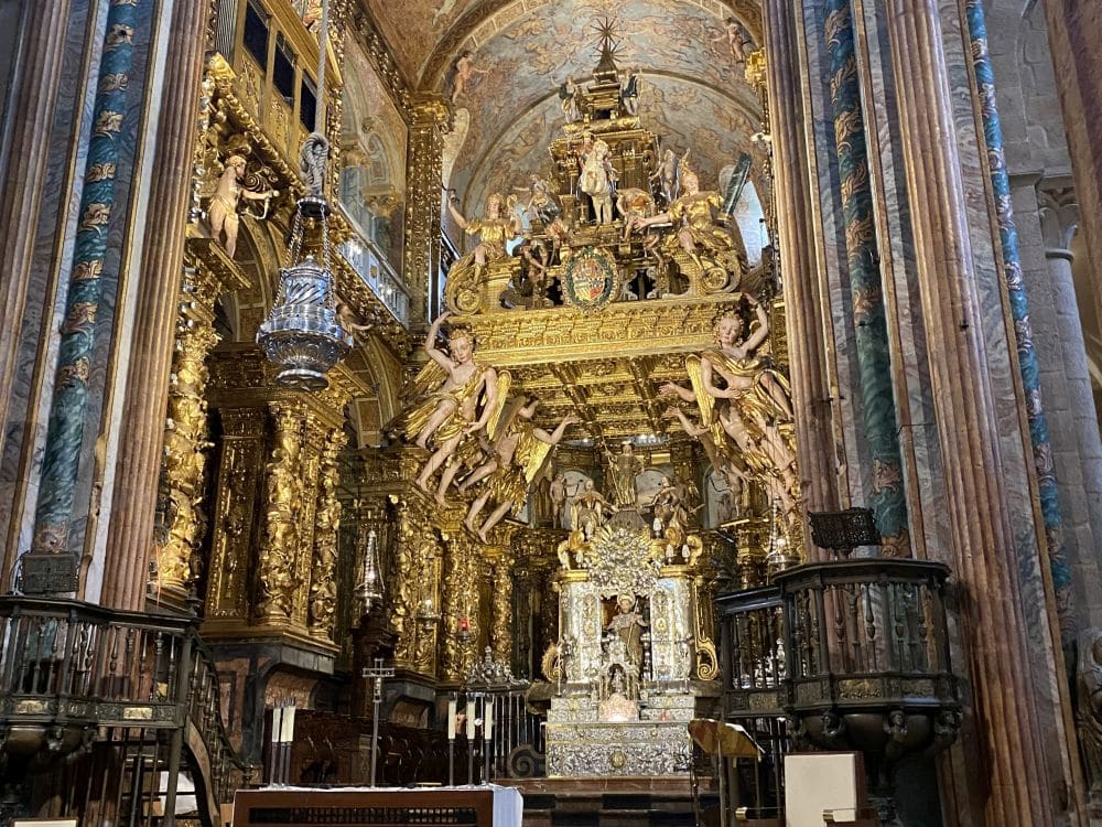 Very ornate and huge altar and structure above it.