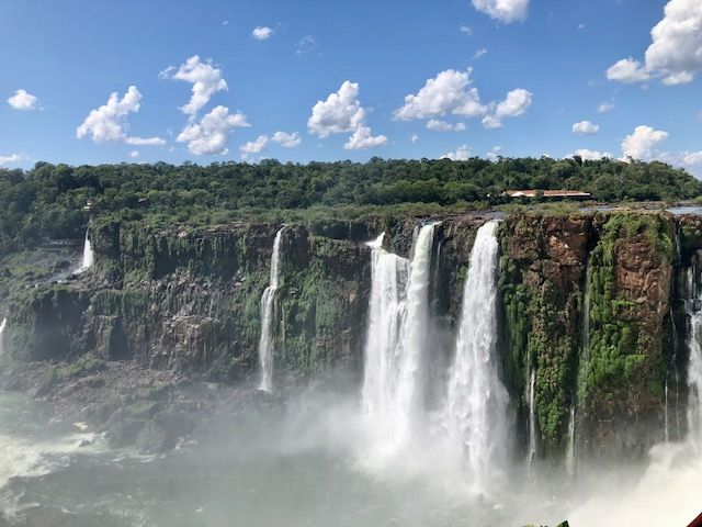 Several narrow waterfalls over the edge of a cliff.