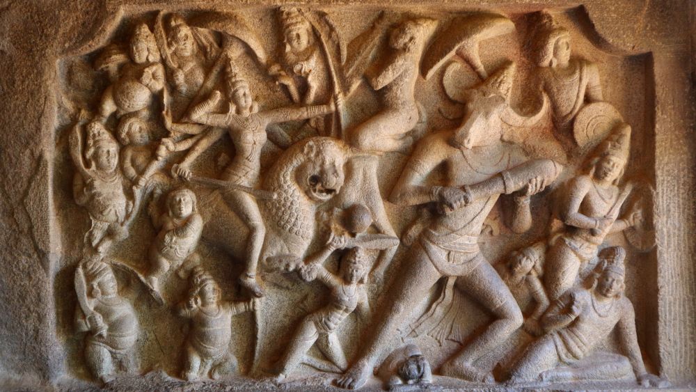 Bas-relief of fighting figures, on foot and one on the back of an animal (a lion?). One has the head of a bull or buffalo on a human body.