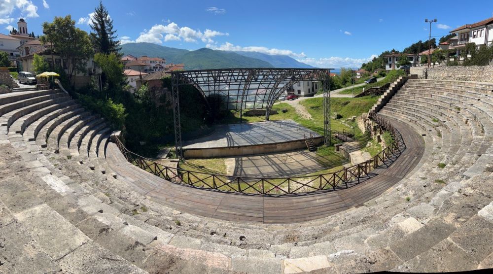 Semicircular amphitheater sloped down to a stage.