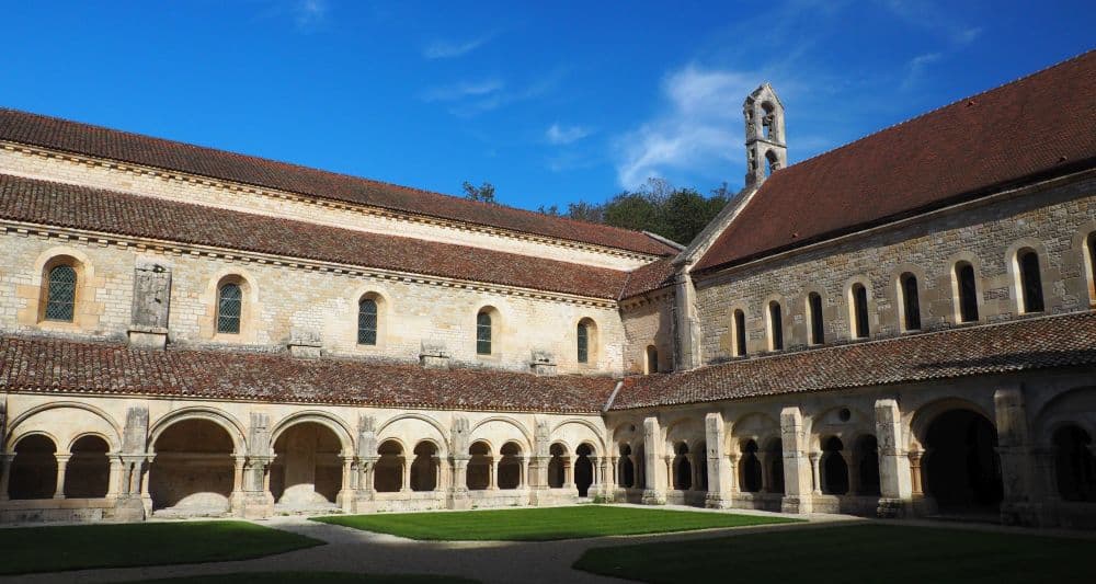 Two sides of the cloister, with its porticos on the ground floor.