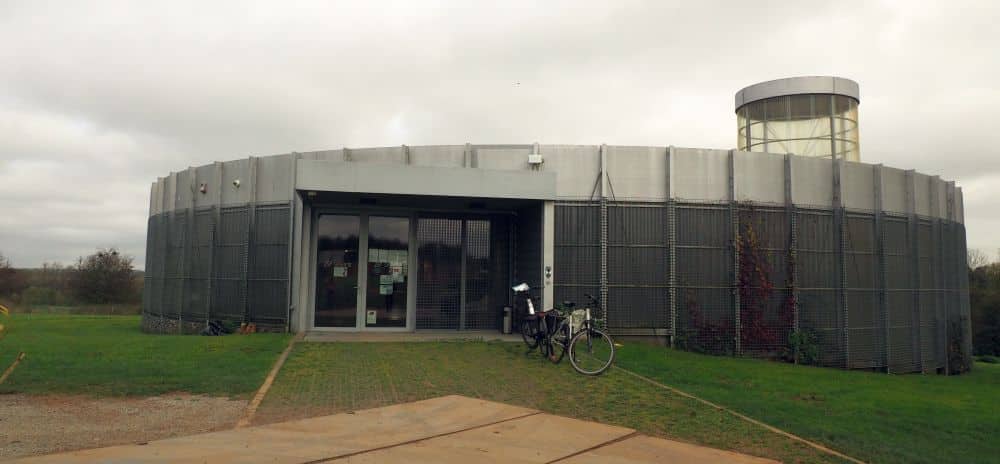 A single-story round building with a flat roof.