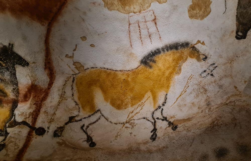 Image of a horse on a rock wall.