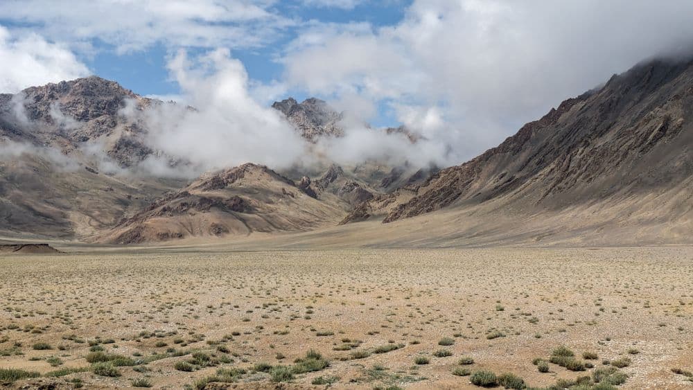 Mountains partly obscured by clouds.