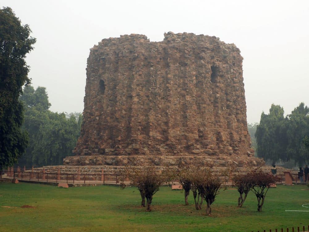 A cylindrical stone structure.