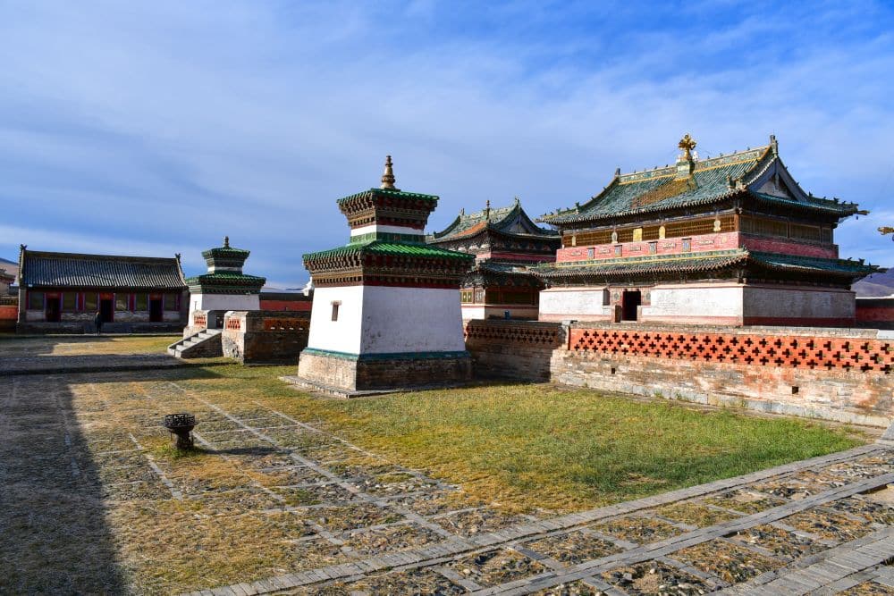 Monastery buildings with 2 short, square gates flanking the entrance.