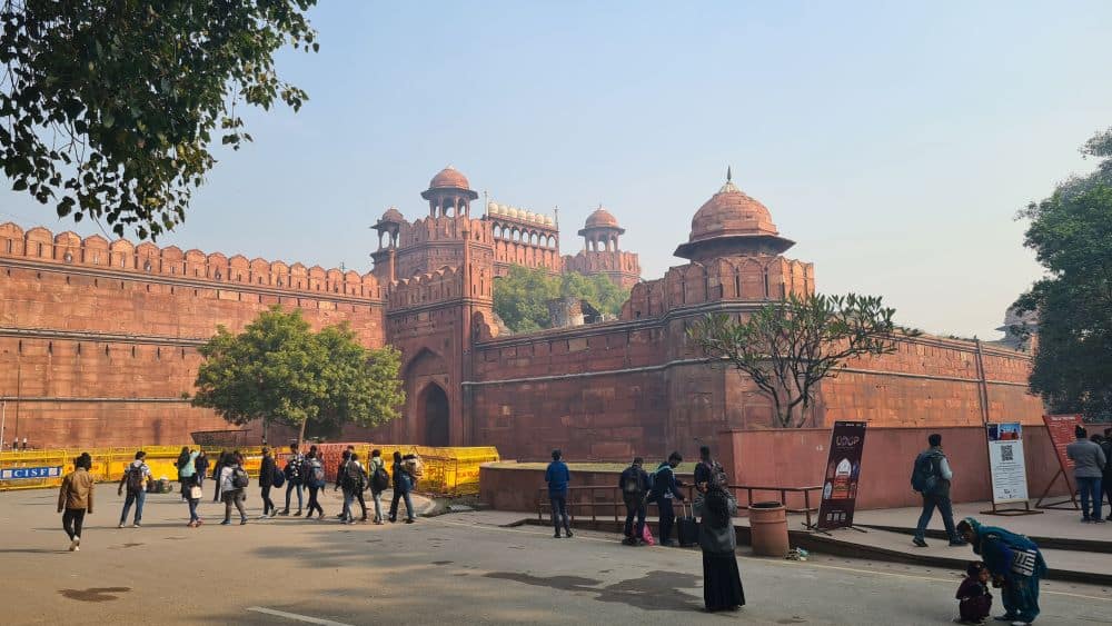 Red-colored walls and turrets of the entrance to the fort.