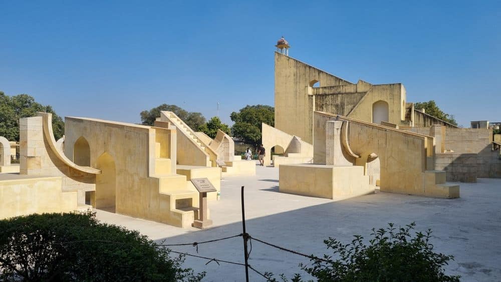 Various white-plastered structures in a courtyard.