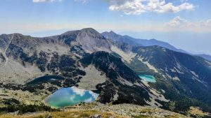 A mountainous landscape with blue glacial lakes.