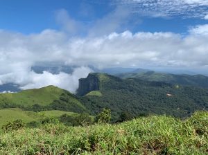 A view of a mountainous and green landscape in the Western Ghats.