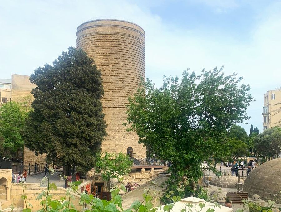 A tall, cylindrical stone tower in the Walled City of Baku.