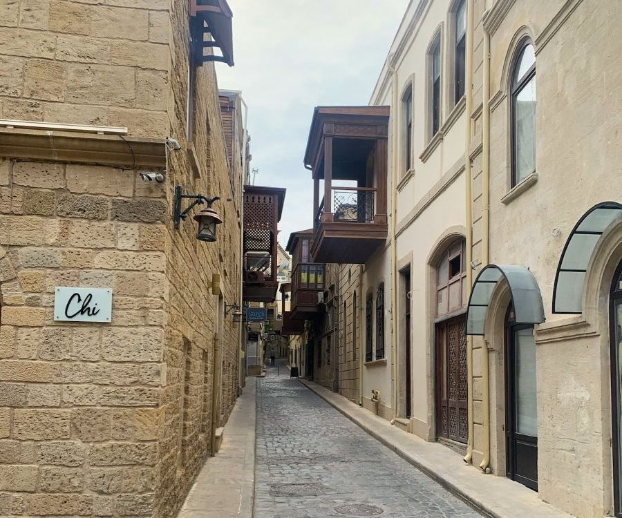 A narrow, cobbled city street.