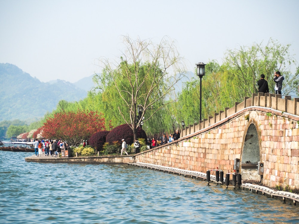 A stone causeway crosses the lake.